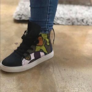 High top tennis shoe.